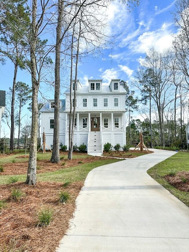 Front exterior of a new home in , Awendaw, SC, highlighting curb appeal (Image 1). Front exterior of a new home in , Awendaw, SC, highlighting curb appeal (Image 1).