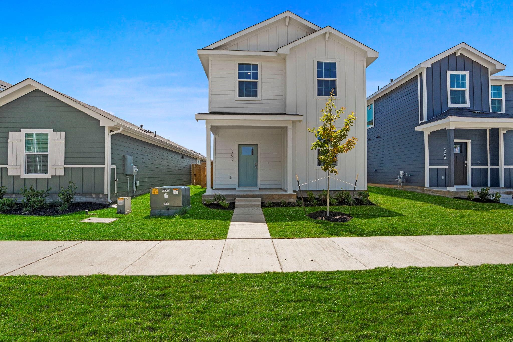 Front exterior of a new home in Valverde, Bastrop, TX, highlighting curb appeal (Image 1). Front exterior of a new home in Valverde, Bastrop, TX, highlighting curb appeal (Image 1).