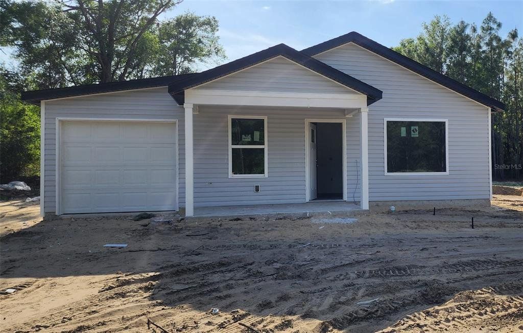 Front exterior of a new home in , Ocala, FL, highlighting curb appeal (Image 1). Front exterior of a new home in , Ocala, FL, highlighting curb appeal (Image 1).