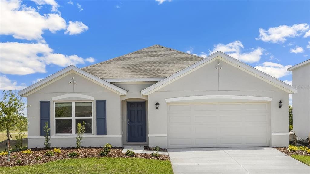 Front exterior of a new home in Oakfield Lakes, Parrish, FL, highlighting curb appeal (Image 1).