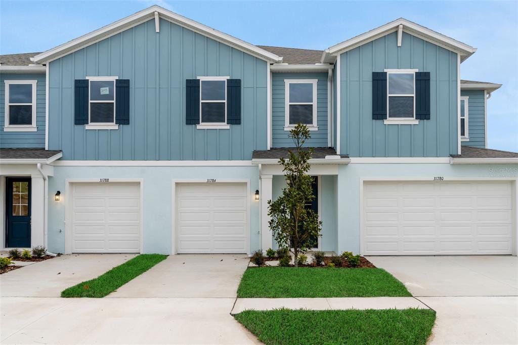 Front exterior of a new home in Shores at Mirada, San Antonio, FL, highlighting curb appeal (Image 1). Front exterior of a new home in Shores at Mirada, San Antonio, FL, highlighting curb appeal (Image 1).