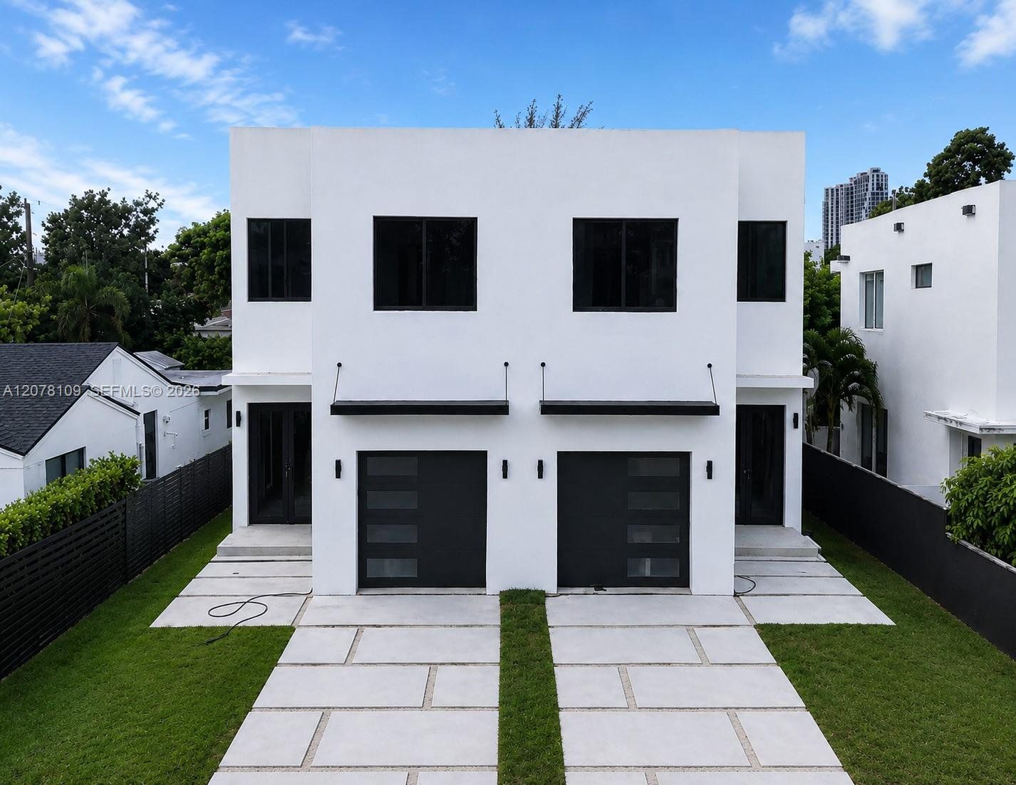 Front exterior of a new home in , Miami, FL, highlighting curb appeal (Image 1). Front exterior of a new home in , Miami, FL, highlighting curb appeal (Image 1).
