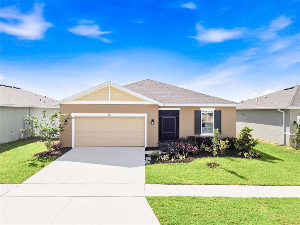Front exterior of a new home in , Haines City, FL, highlighting curb appeal (Image 1). Front exterior of a new home in , Haines City, FL, highlighting curb appeal (Image 1).