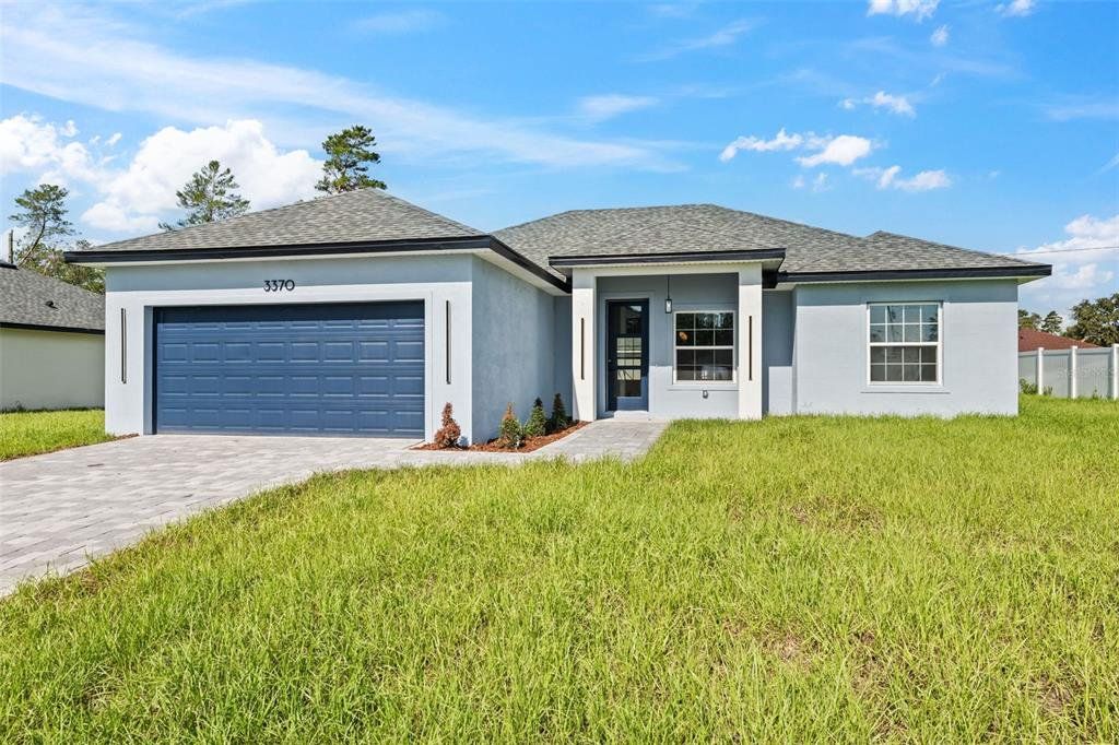 Front exterior of a new home in , Ocala, FL, highlighting curb appeal (Image 1). Front exterior of a new home in , Ocala, FL, highlighting curb appeal (Image 1).
