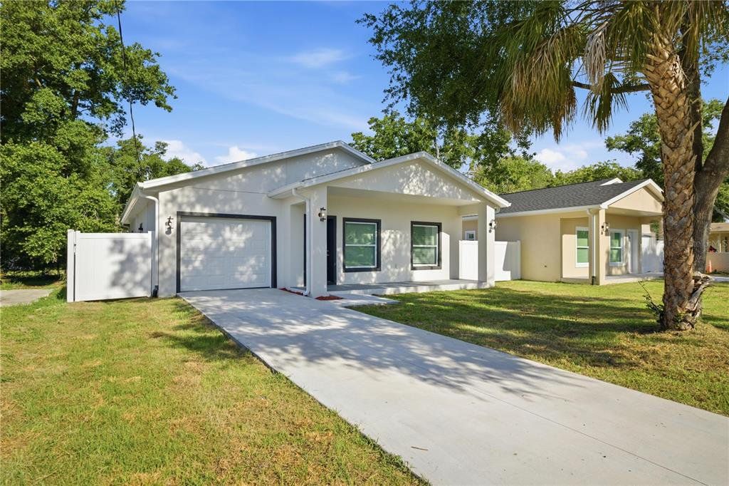 Front exterior of a new home in , Tampa, FL, highlighting curb appeal (Image 1). Front exterior of a new home in , Tampa, FL, highlighting curb appeal (Image 1).