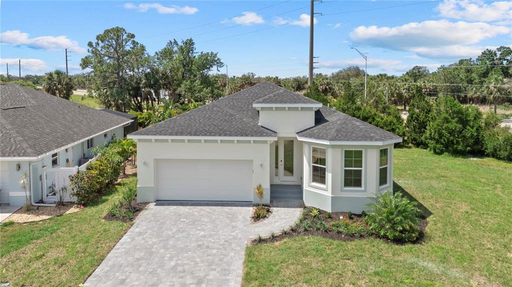 Front exterior of a new home in , Punta Gorda, FL, highlighting curb appeal (Image 1). Front exterior of a new home in , Punta Gorda, FL, highlighting curb appeal (Image 1).