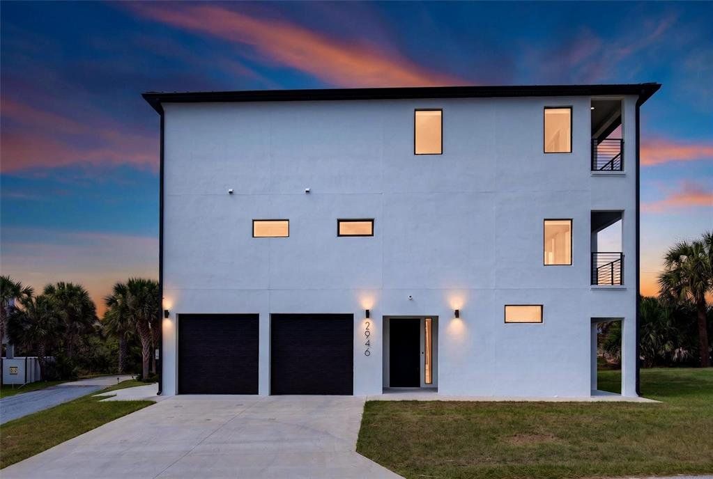Front exterior of a new home in , Flagler Beach, FL, highlighting curb appeal (Image 1). Front exterior of a new home in , Flagler Beach, FL, highlighting curb appeal (Image 1).
