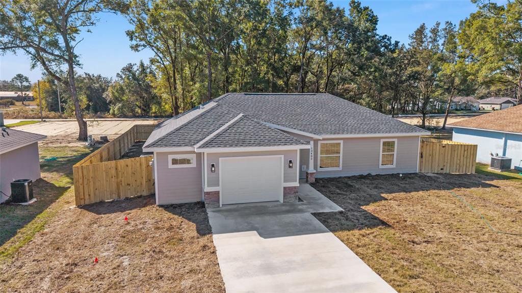 Front exterior of a new home in , Dunnellon, FL, highlighting curb appeal (Image 1). Front exterior of a new home in , Dunnellon, FL, highlighting curb appeal (Image 1).