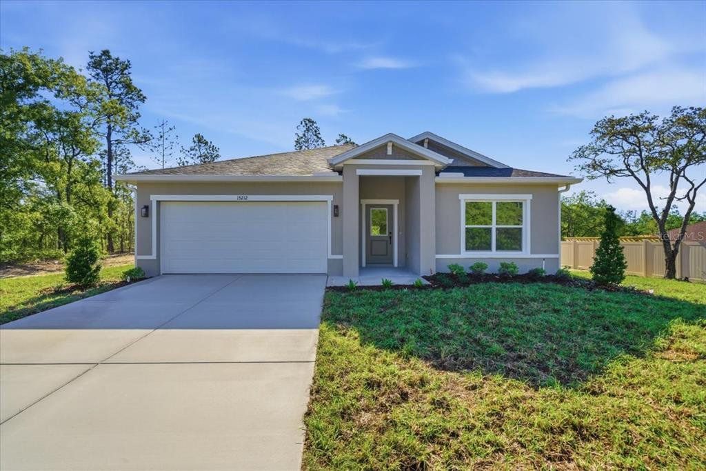 Front exterior of a new home in , Weeki Wachee, FL, highlighting curb appeal (Image 1). Front exterior of a new home in , Weeki Wachee, FL, highlighting curb appeal (Image 1).