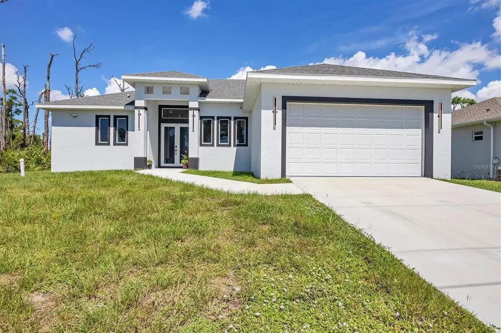 Front exterior of a new home in , Placida, FL, highlighting curb appeal (Image 1). Front exterior of a new home in , Placida, FL, highlighting curb appeal (Image 1).
