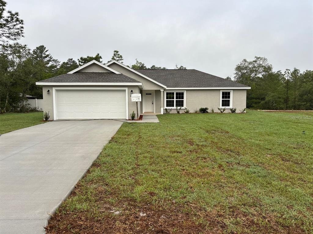 Front exterior of a new home in , Dunnellon, FL, highlighting curb appeal (Image 1). Front exterior of a new home in , Dunnellon, FL, highlighting curb appeal (Image 1).