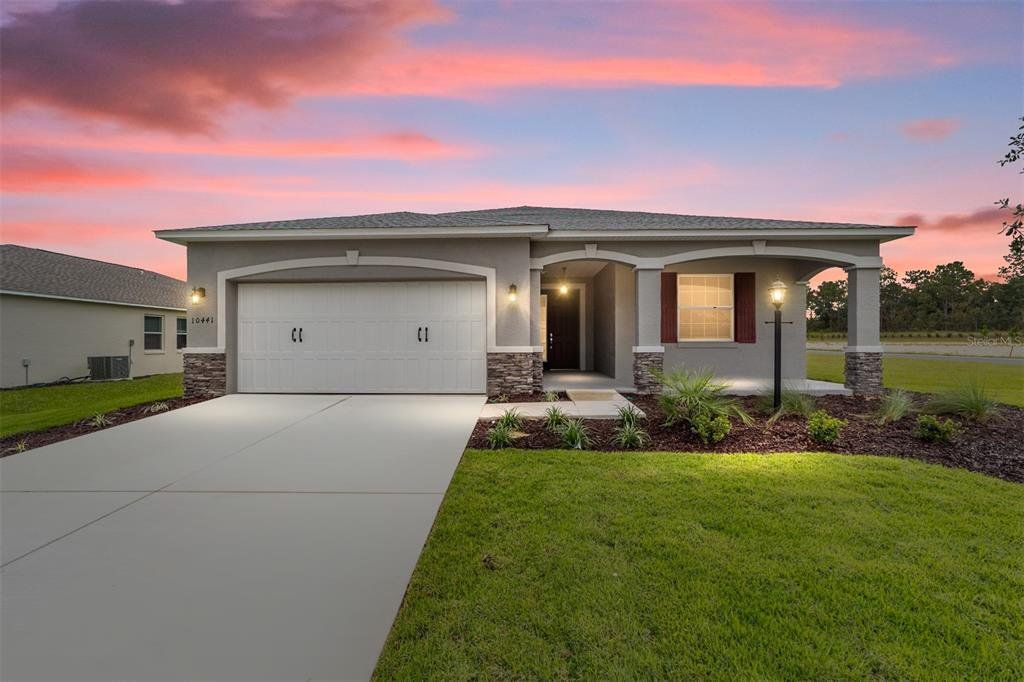 Front exterior of a new home in On Top of the World Communities, Ocala, FL, highlighting curb appeal (Image 1). Front exterior of a new home in On Top of the World Communities, Ocala, FL, highlighting curb appeal (Image 1).