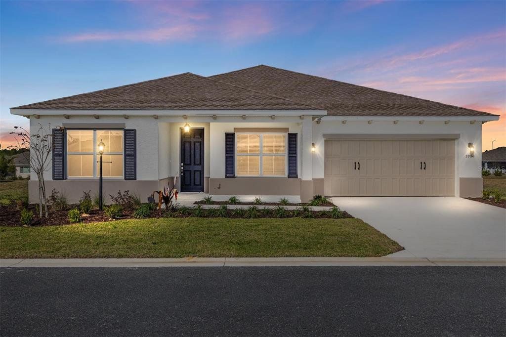 Front exterior of a new home in On Top of the World Communities, Ocala, FL, highlighting curb appeal (Image 1). Front exterior of a new home in On Top of the World Communities, Ocala, FL, highlighting curb appeal (Image 1).
