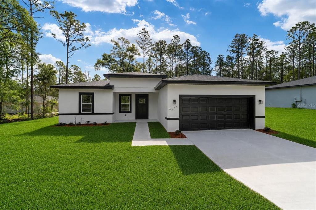 Front exterior of a new home in , Citrus Springs, FL, highlighting curb appeal (Image 1). Front exterior of a new home in , Citrus Springs, FL, highlighting curb appeal (Image 1).