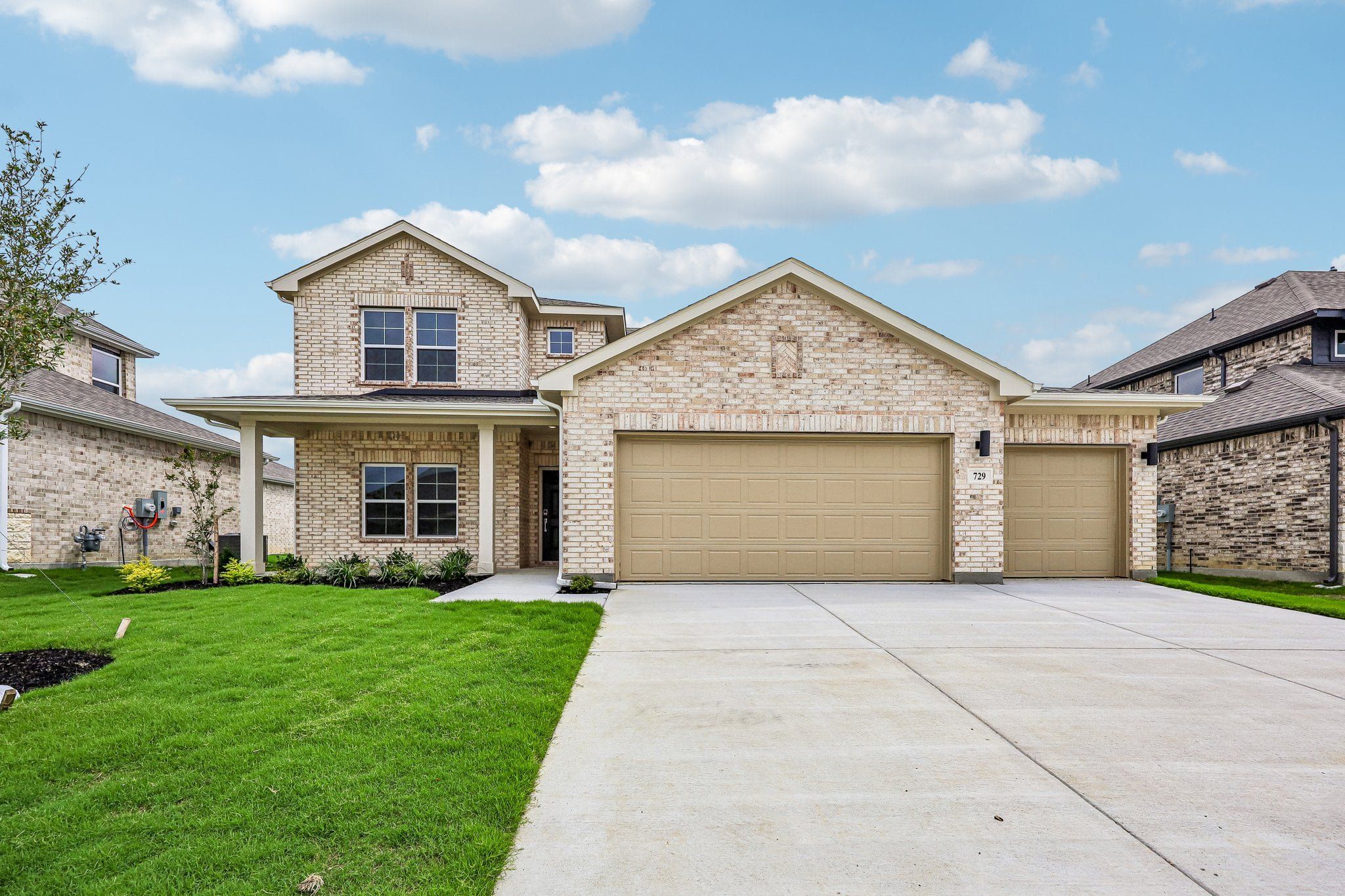 Front exterior of a new home in Overland Grove, Forney, TX, highlighting curb appeal (Image 1). Front exterior of a new home in Overland Grove, Forney, TX, highlighting curb appeal (Image 1).