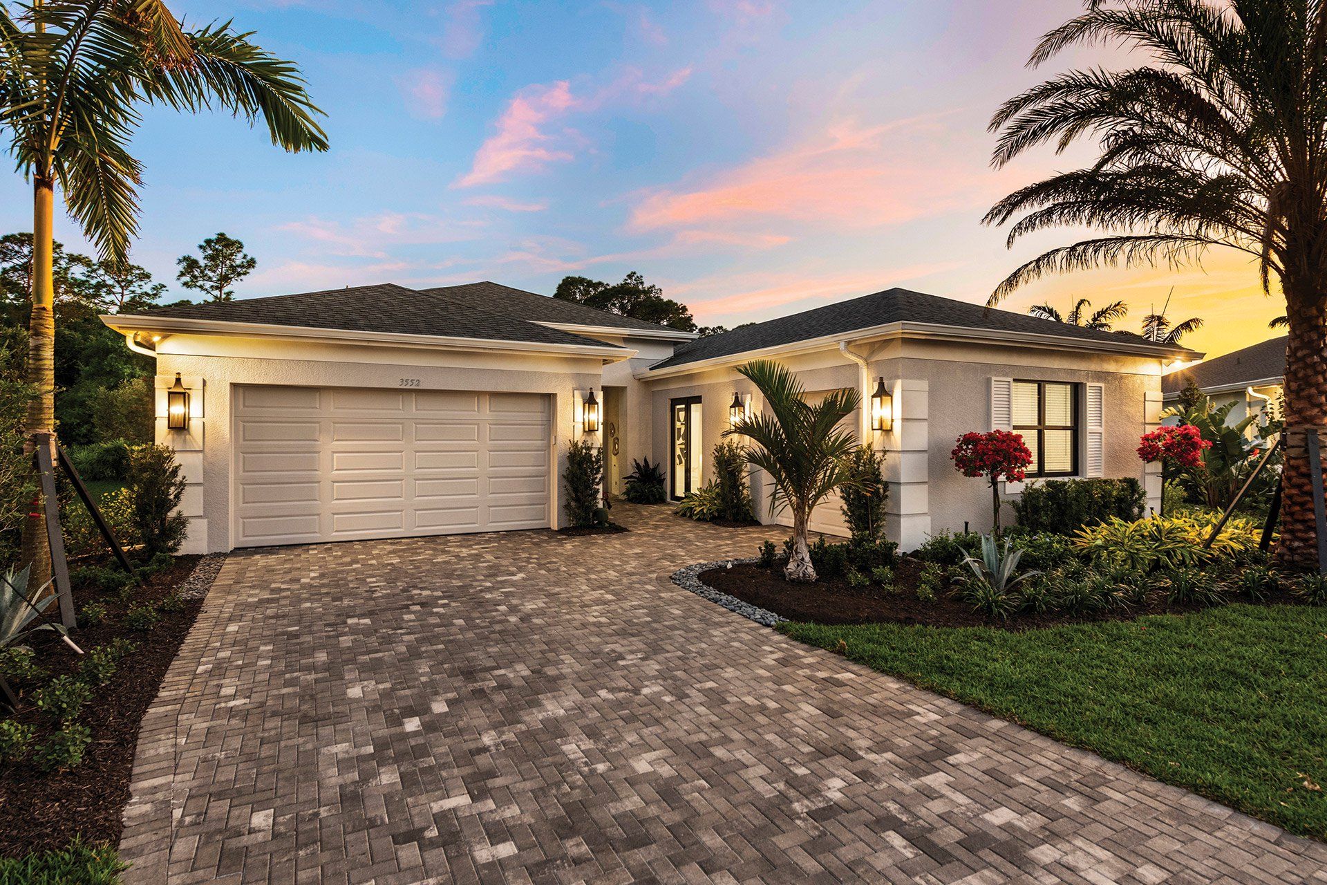 Front exterior of a new home in Valencia Harbor (55+), Fort Myers, FL, highlighting curb appeal (Image 1). Front exterior of a new home in Valencia Harbor (55+), Fort Myers, FL, highlighting curb appeal (Image 1).