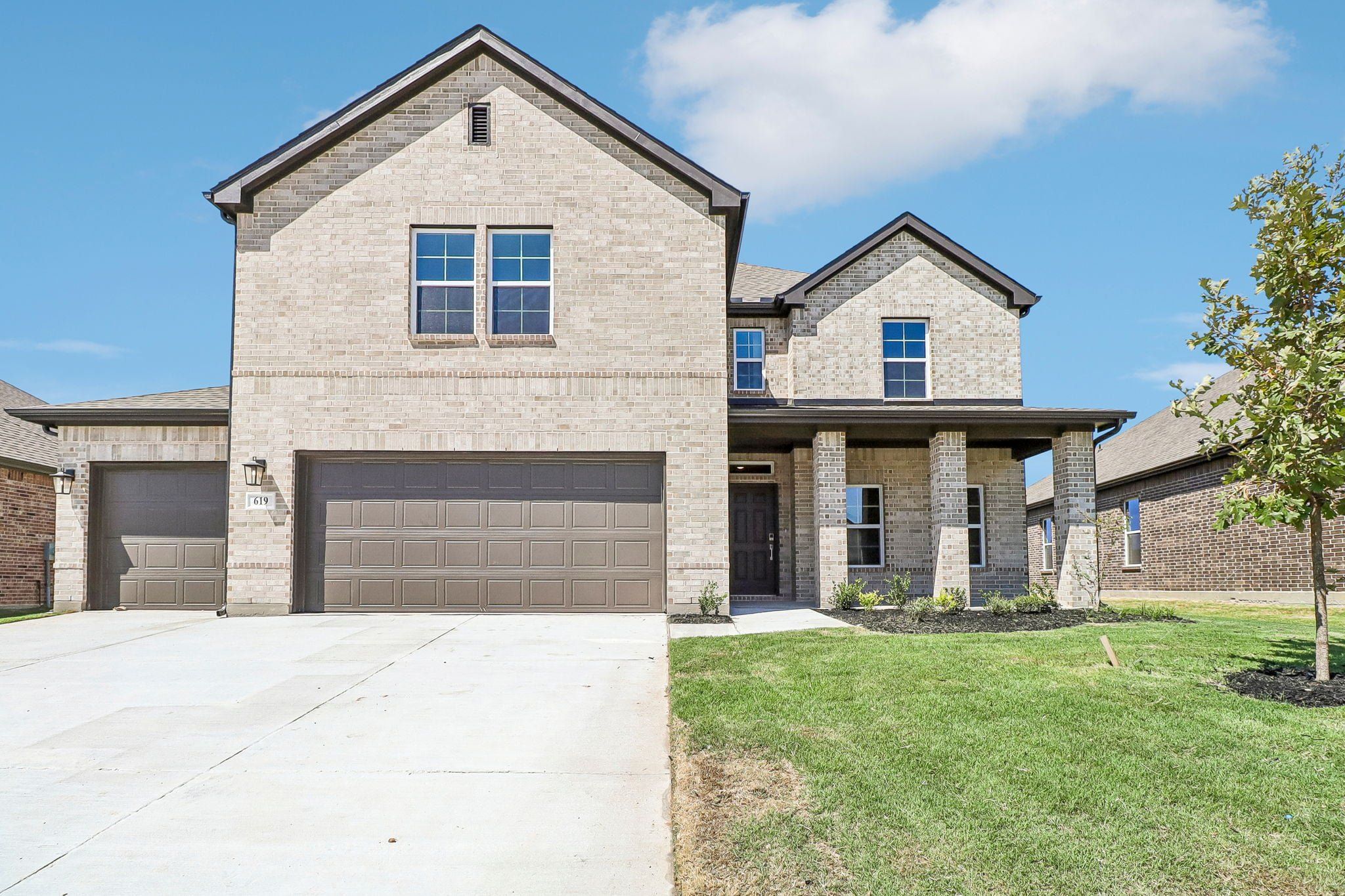 Front exterior of a new home in Overland Grove, Forney, TX, highlighting curb appeal (Image 1). Front exterior of a new home in Overland Grove, Forney, TX, highlighting curb appeal (Image 1).