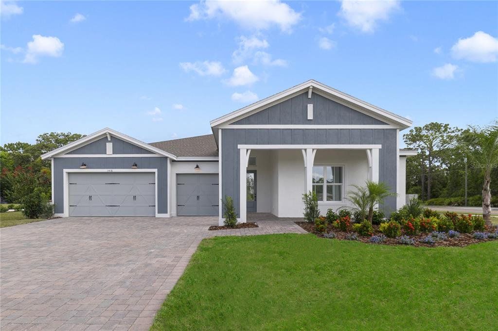Front exterior of a new home in Eden Preserve, Altamonte Springs, FL, highlighting curb appeal (Image 1). Front exterior of a new home in Eden Preserve, Altamonte Springs, FL, highlighting curb appeal (Image 1).