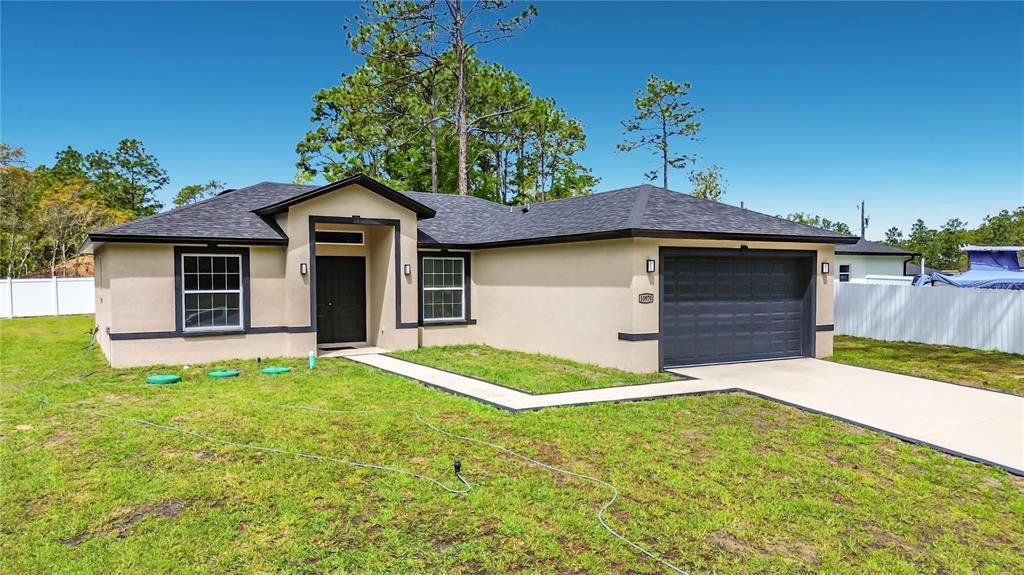 Front exterior of a new home in , Citrus Springs, FL, highlighting curb appeal (Image 1). Front exterior of a new home in , Citrus Springs, FL, highlighting curb appeal (Image 1).