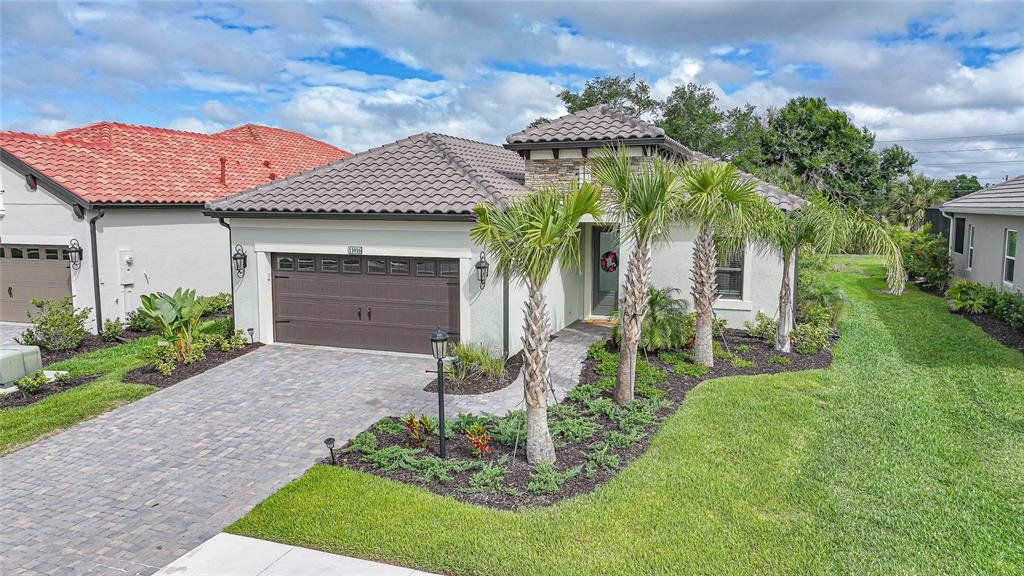 Front exterior of a new home in , Englewood, FL, highlighting curb appeal (Image 1). Front exterior of a new home in , Englewood, FL, highlighting curb appeal (Image 1).