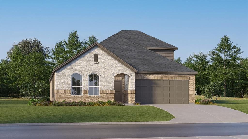 French country inspired facade featuring a front yard, concrete driveway, brick siding, and stone siding