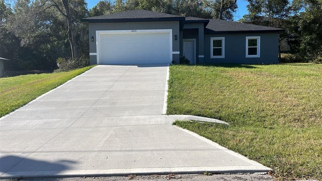 Front exterior of a new home in , Citrus Springs, FL, highlighting curb appeal (Image 1). Front exterior of a new home in , Citrus Springs, FL, highlighting curb appeal (Image 1).