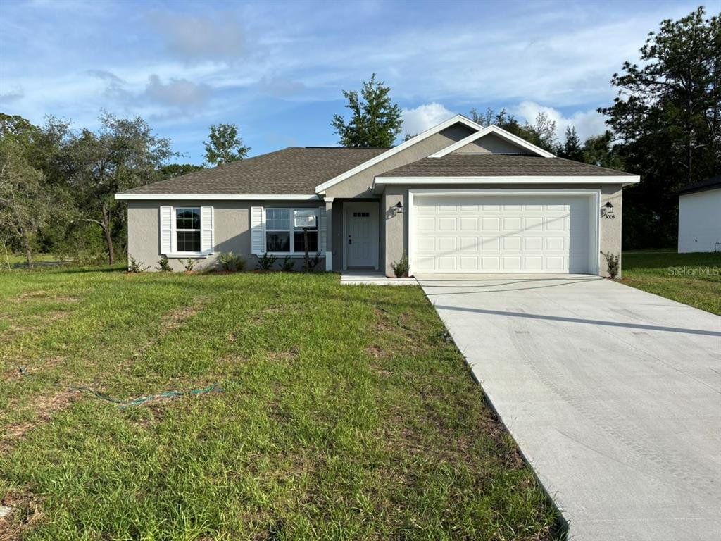Front exterior of a new home in , Dunnellon, FL, highlighting curb appeal (Image 1). Front exterior of a new home in , Dunnellon, FL, highlighting curb appeal (Image 1).