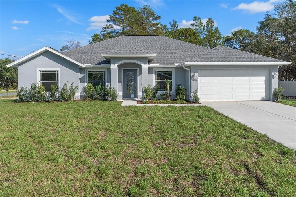 Front exterior of a new home in , Weeki Wachee, FL, highlighting curb appeal (Image 1). Front exterior of a new home in , Weeki Wachee, FL, highlighting curb appeal (Image 1).