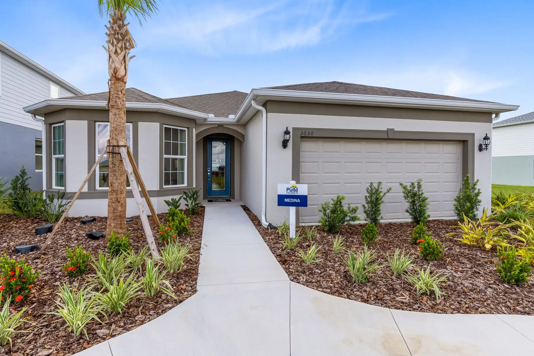 Front exterior of a new home in Hartford Terrace, Davenport, FL, highlighting curb appeal (Image 1).