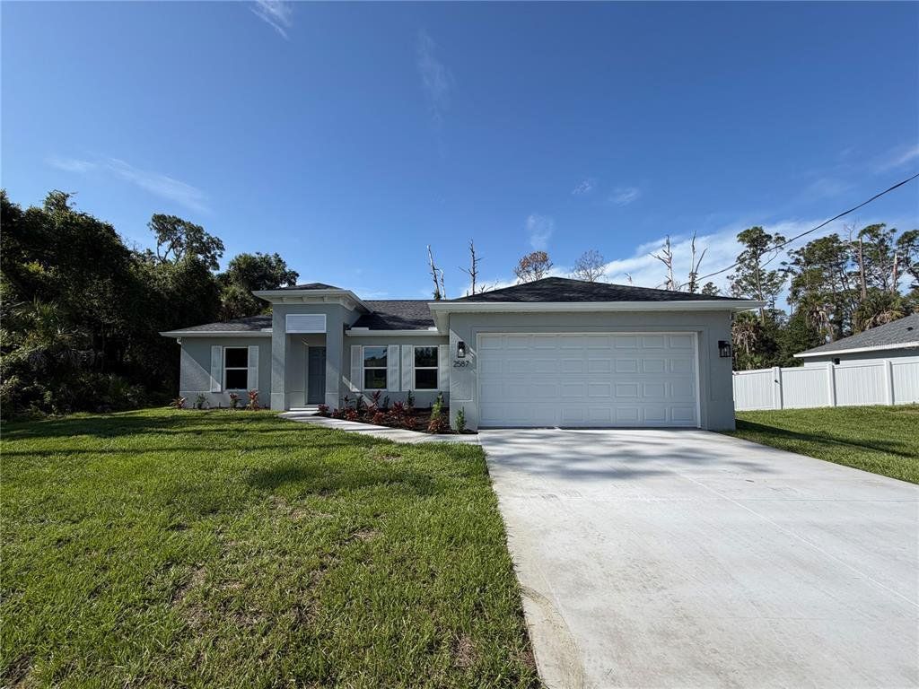 Front exterior of a new home in , North Port, FL, highlighting curb appeal (Image 1). Front exterior of a new home in , North Port, FL, highlighting curb appeal (Image 1).