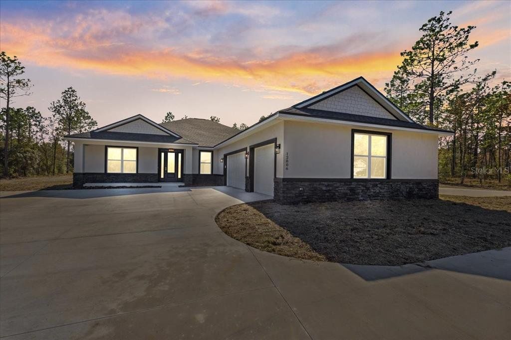 Front exterior of a new home in , Dunnellon, FL, highlighting curb appeal (Image 1). Front exterior of a new home in , Dunnellon, FL, highlighting curb appeal (Image 1).