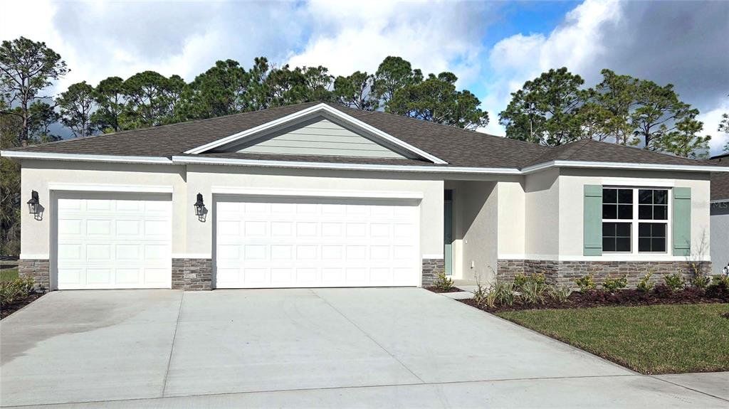 Front exterior of a new home in Fountain View, Ormond Beach, FL, highlighting curb appeal (Image 1). Front exterior of a new home in Fountain View, Ormond Beach, FL, highlighting curb appeal (Image 1).