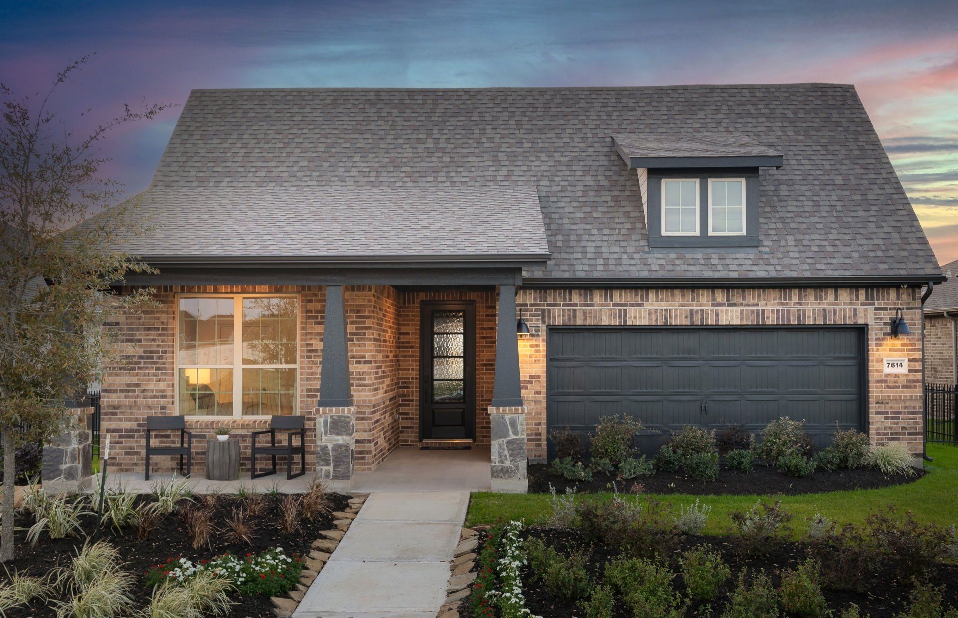 Front exterior of a new home in Del Webb Fulshear, Fulshear, TX, highlighting curb appeal (Image 1). Front exterior of a new home in Del Webb Fulshear, Fulshear, TX, highlighting curb appeal (Image 1).