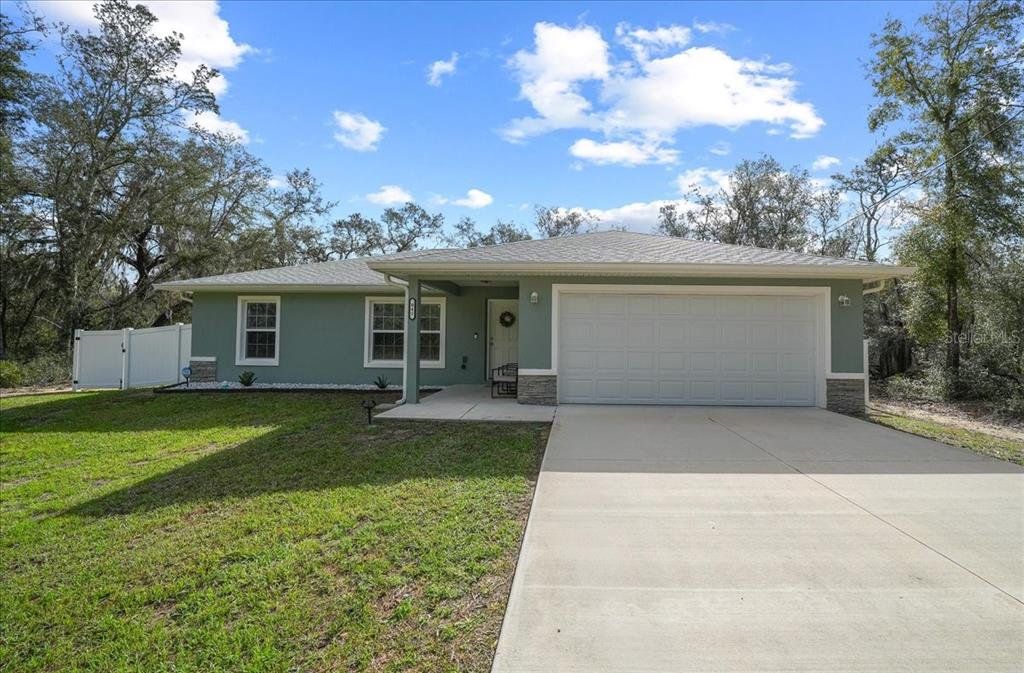 Front exterior of a new home in , Ocklawaha, FL, highlighting curb appeal (Image 1). Front exterior of a new home in , Ocklawaha, FL, highlighting curb appeal (Image 1).