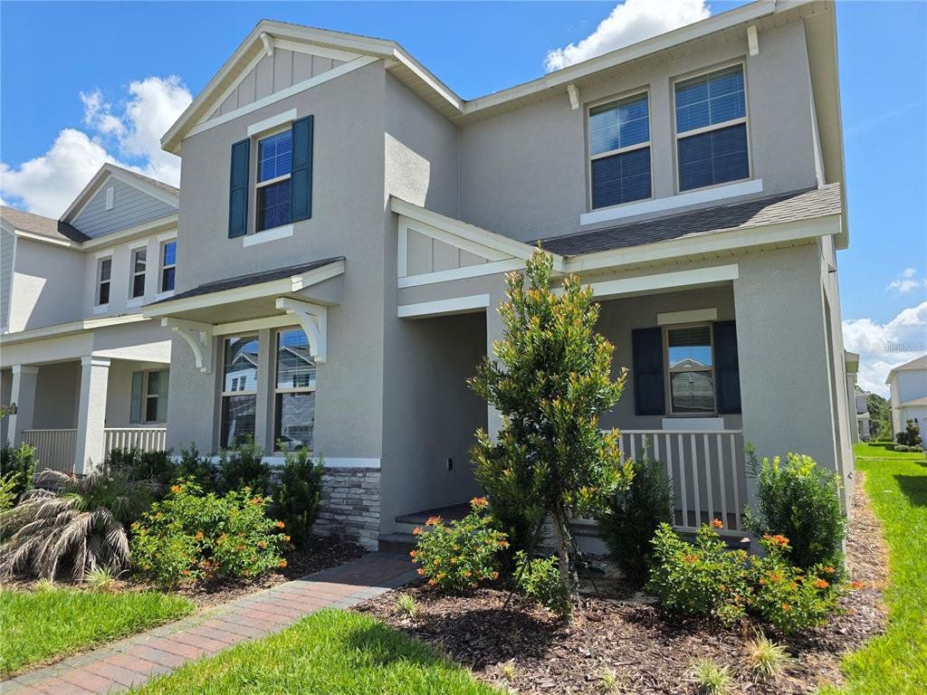 Front exterior of a new home in , Winter Garden, FL, highlighting curb appeal (Image 1). Front exterior of a new home in , Winter Garden, FL, highlighting curb appeal (Image 1).