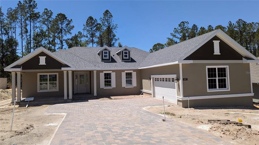 Front exterior of a new home in Southern Hills Plantation, Brooksville, FL, highlighting curb appeal (Image 1).