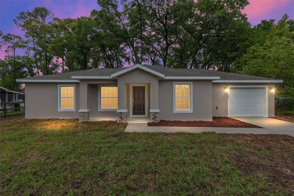 Front exterior of a new home in , Belleview, FL, highlighting curb appeal (Image 1). Front exterior of a new home in , Belleview, FL, highlighting curb appeal (Image 1).