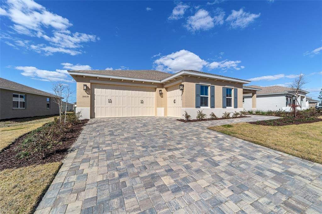 Front exterior of a new home in , Ocala, FL, highlighting curb appeal (Image 1). Front exterior of a new home in , Ocala, FL, highlighting curb appeal (Image 1).