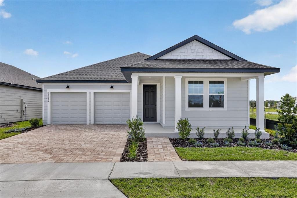 Front exterior of a new home in Trailside, Mount Dora, FL, highlighting curb appeal (Image 1). Front exterior of a new home in Trailside, Mount Dora, FL, highlighting curb appeal (Image 1).