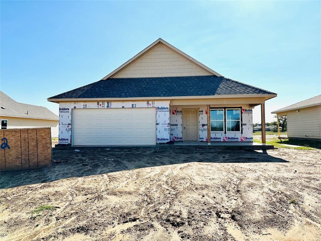 Property in mid-construction featuring roof with shingles, a garage, driveway, and a porch