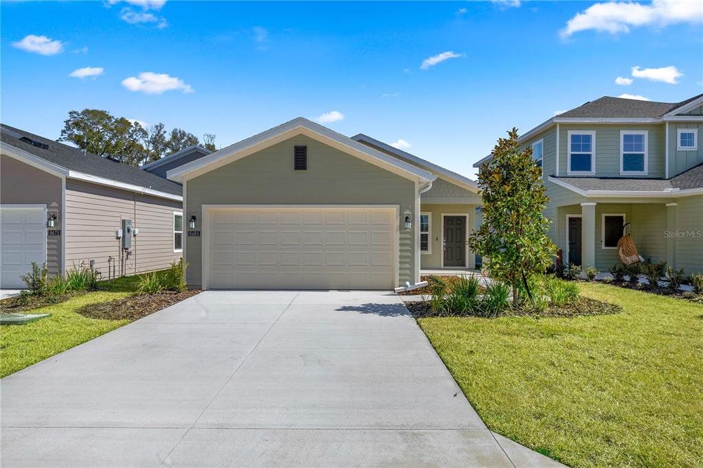 Front exterior of a new home in Pioneer Ranch, Ocala, FL, highlighting curb appeal (Image 1). Front exterior of a new home in Pioneer Ranch, Ocala, FL, highlighting curb appeal (Image 1).