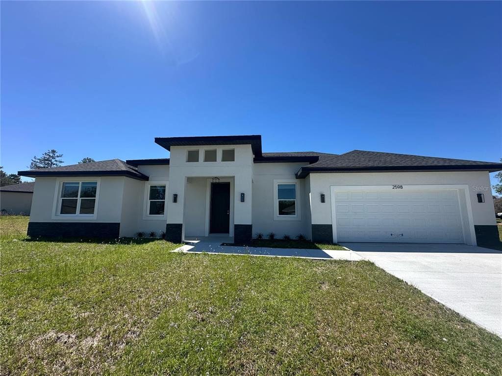 Front exterior of a new home in , Ocala, FL, highlighting curb appeal (Image 1). Front exterior of a new home in , Ocala, FL, highlighting curb appeal (Image 1).