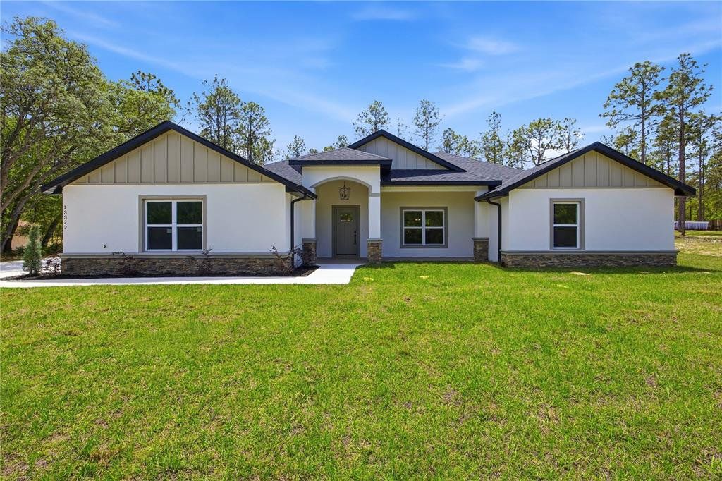 Front exterior of a new home in , Ocala, FL, highlighting curb appeal (Image 1). Front exterior of a new home in , Ocala, FL, highlighting curb appeal (Image 1).