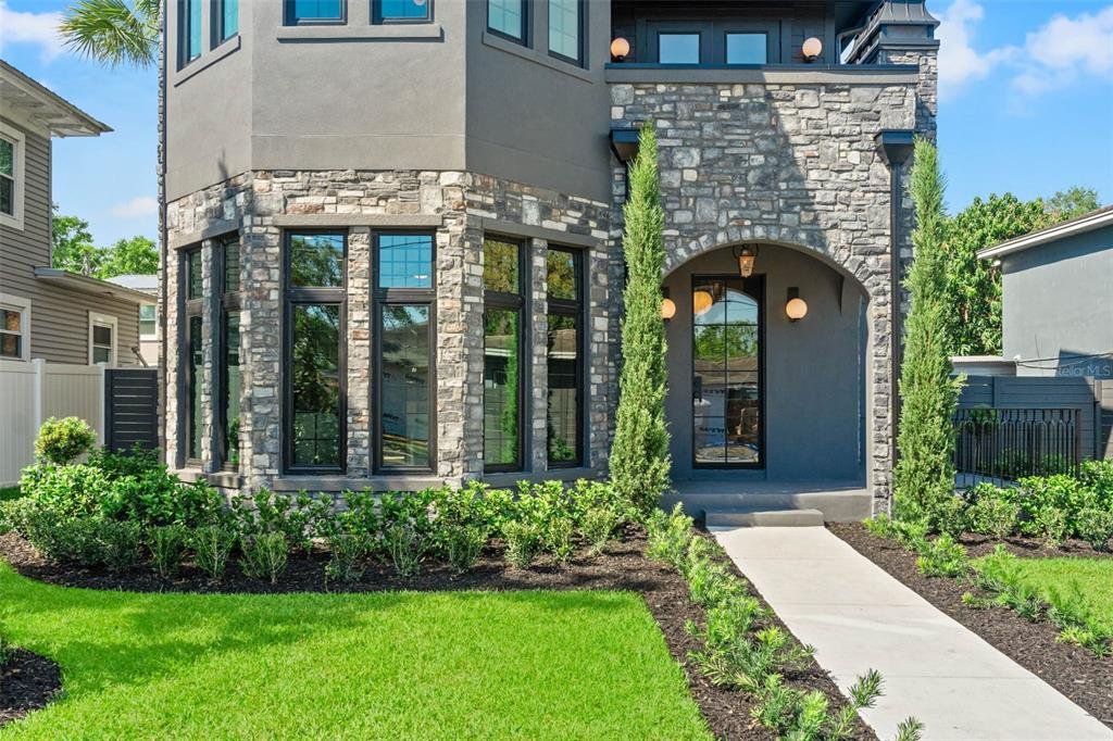 Front exterior of a new home in , Tampa, FL, highlighting curb appeal (Image 1). Front exterior of a new home in , Tampa, FL, highlighting curb appeal (Image 1).