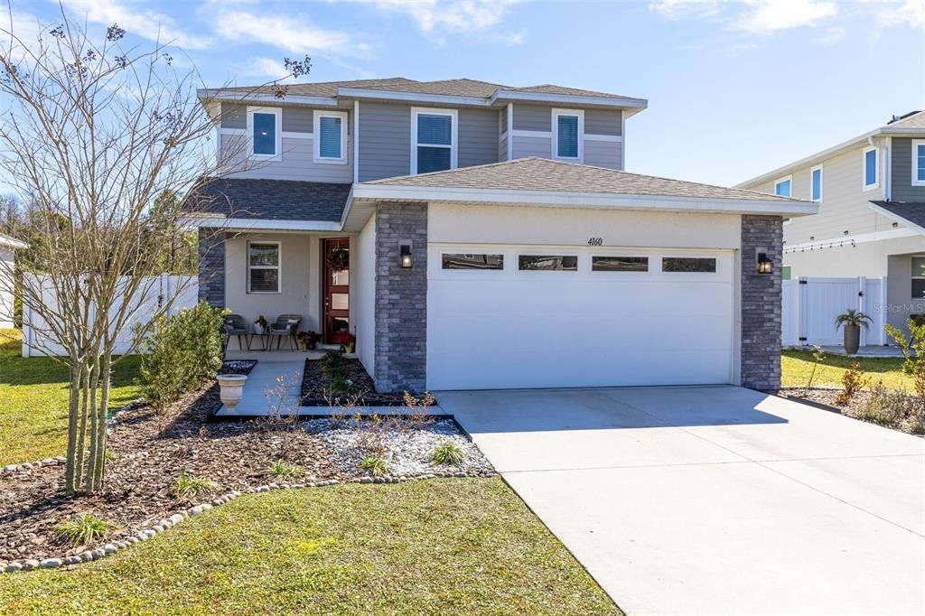 Front exterior of a new home in , St. Cloud, FL, highlighting curb appeal (Image 1). Front exterior of a new home in , St. Cloud, FL, highlighting curb appeal (Image 1).