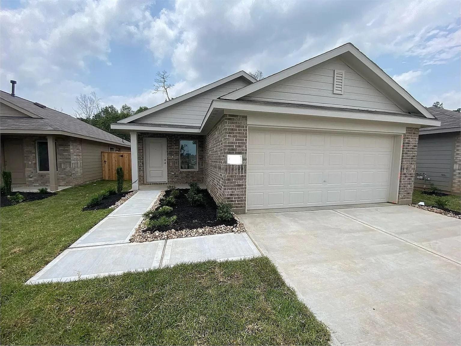 Front exterior of a new home in , Conroe, TX, highlighting curb appeal (Image 1). Front exterior of a new home in , Conroe, TX, highlighting curb appeal (Image 1).