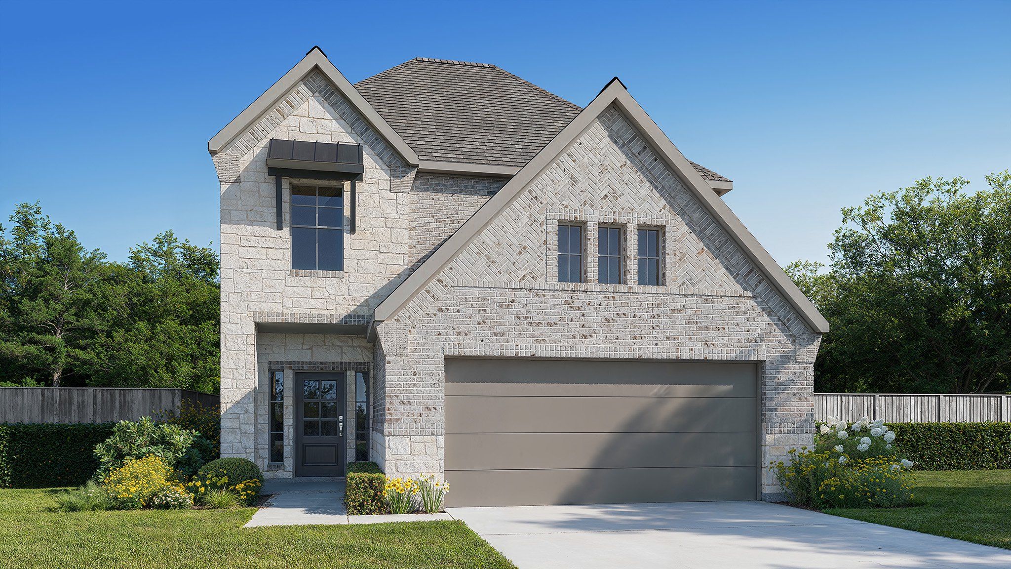 Front exterior of a new home in Jordan Ranch, Fulshear, TX, highlighting curb appeal (Image 1). Front exterior of a new home in Jordan Ranch, Fulshear, TX, highlighting curb appeal (Image 1).