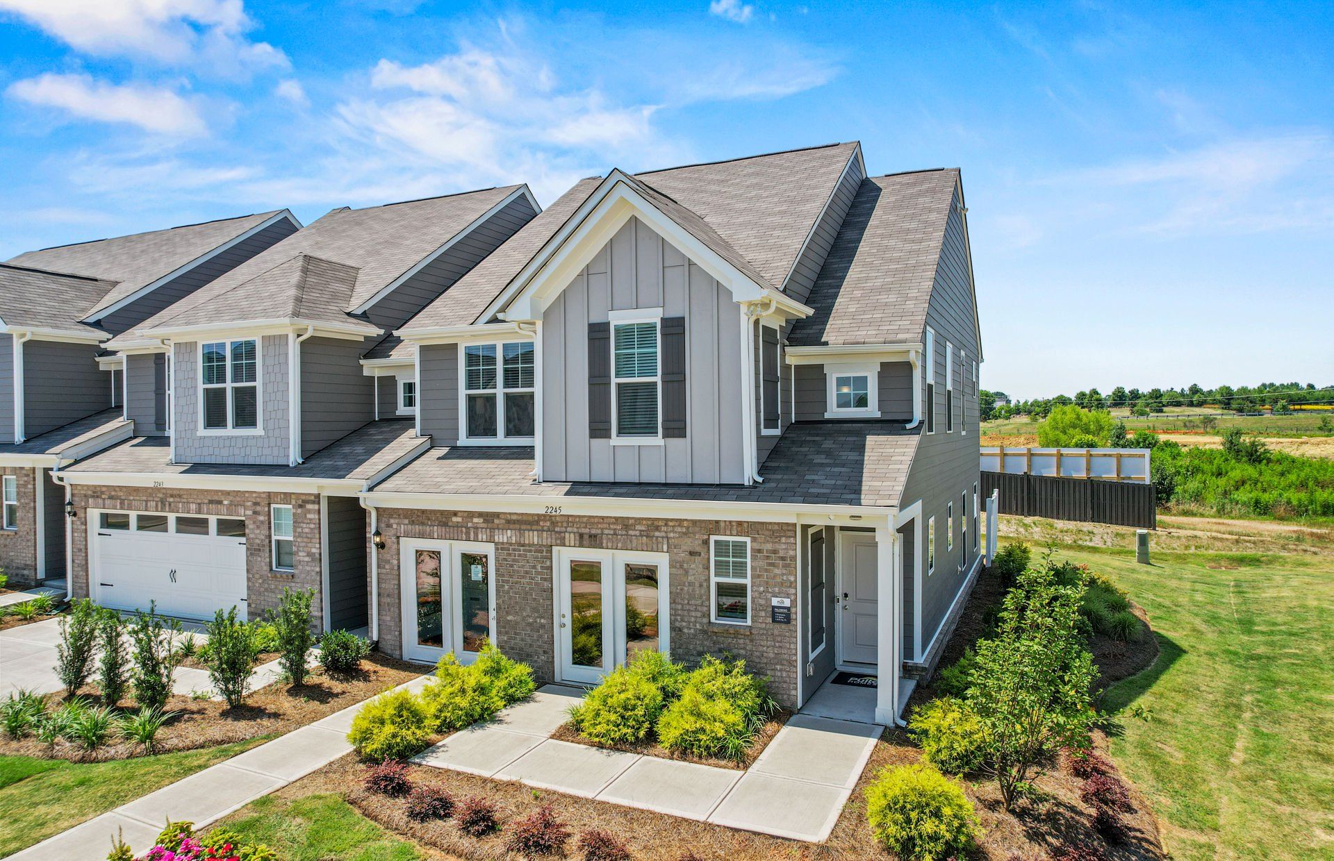 Front exterior of a new home in Riverstone, Monroe, NC, highlighting curb appeal (Image 1). Front exterior of a new home in Riverstone, Monroe, NC, highlighting curb appeal (Image 1).