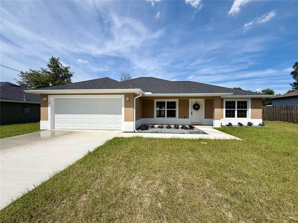 Front exterior of a new home in , Ocala, FL, highlighting curb appeal (Image 1). Front exterior of a new home in , Ocala, FL, highlighting curb appeal (Image 1).