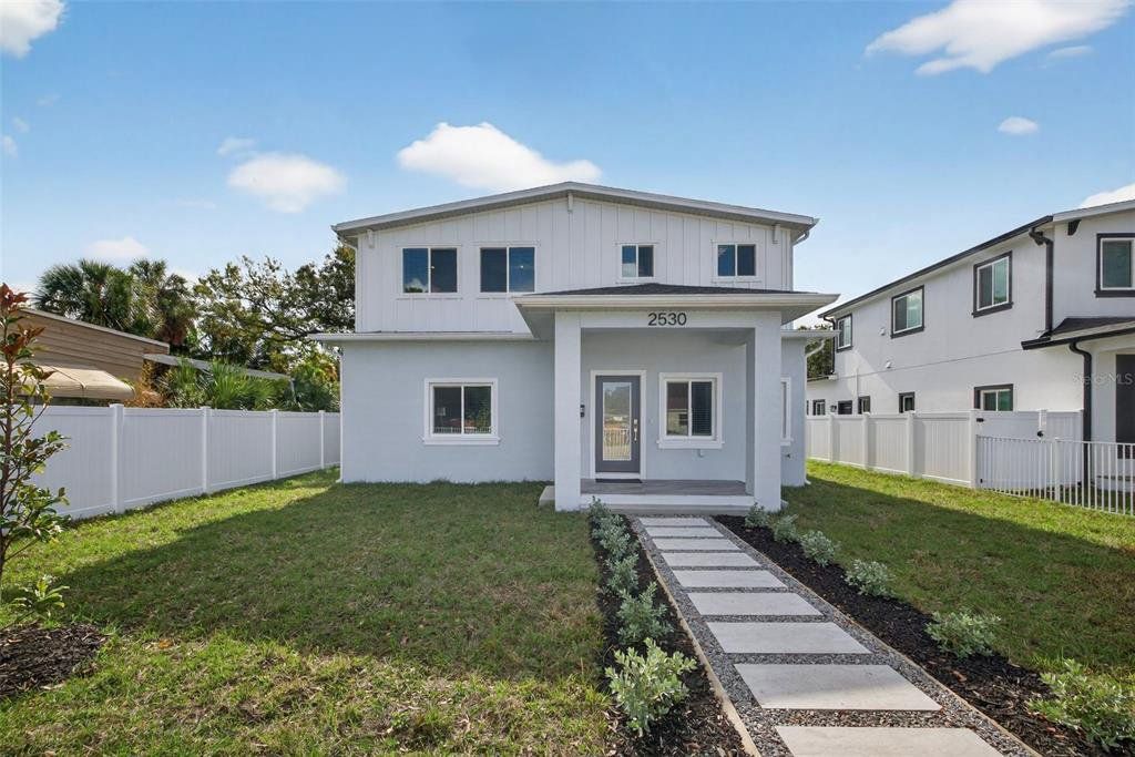 Front exterior of a new home in , St. Petersburg, FL, highlighting curb appeal (Image 1). Front exterior of a new home in , St. Petersburg, FL, highlighting curb appeal (Image 1).